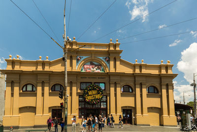 Group of people in front of historical building