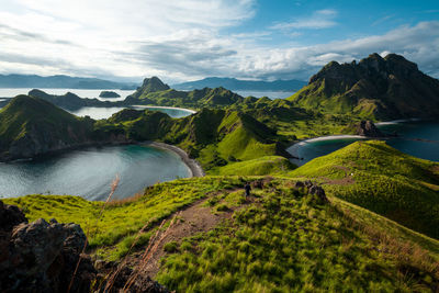 Scenic view of landscape and mountains against sky