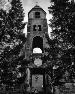 Low angle view of clock tower against building