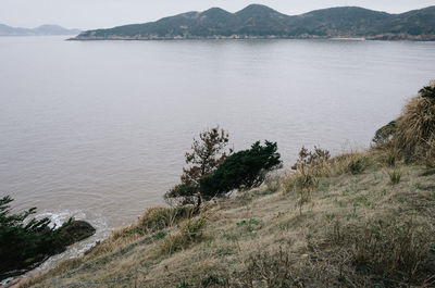 Scenic view of sea against mountains