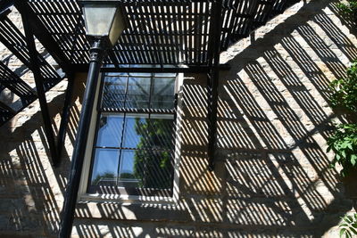 Low angle view of building seen through window