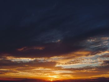 Low angle view of dramatic sky during sunset