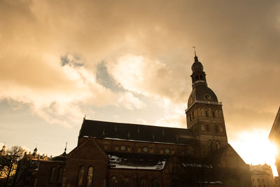 Low angle view of historical building against cloudy sky