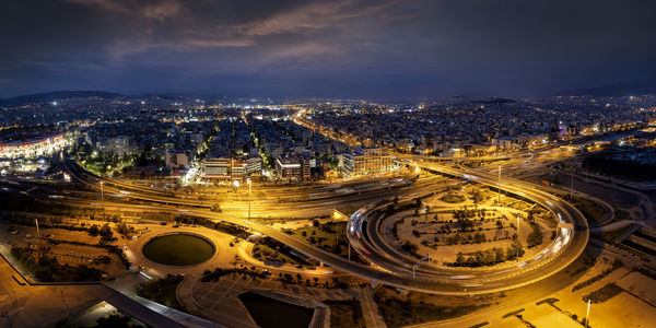 High angle view of illuminated city buildings at night