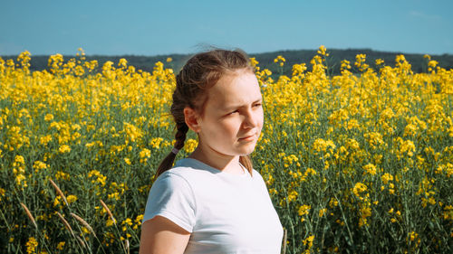 Scenic view of oilseed rape field against sky