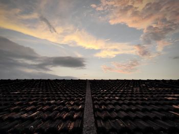 Tiled roof against sky