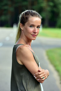 Portrait of smiling woman standing outdoors