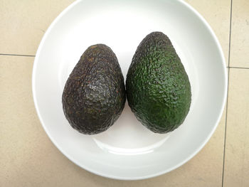 High angle view of fruits in plate on table