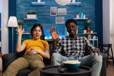 Young couple sitting on sofa