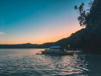 Scenic view of lake against sky during sunset