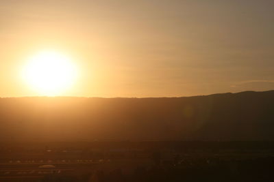 Scenic view of silhouette landscape against sky during sunset