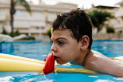 Boy swimming in pool