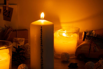 Close-up of illuminated tea light candle