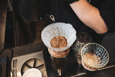 Barista dripping coffee and slow coffee bar style