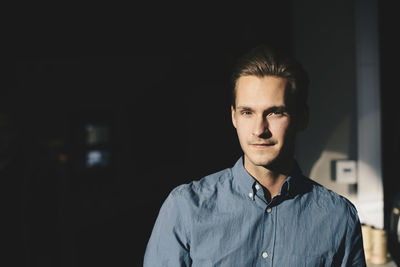 Portrait of confident businessman at office