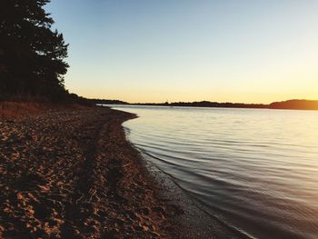 Scenic view of calm sea at sunset