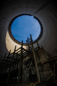 Low angle view of abandoned building against sky