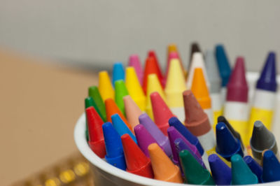 Close-up of multi colored pencils on table