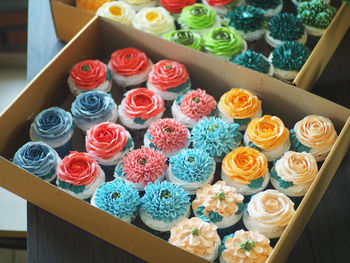 High angle view of multi colored roses on table