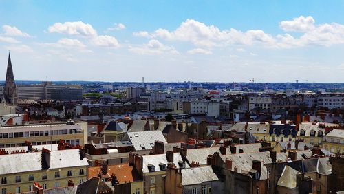 Aerial view of cityscape against sky