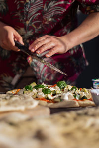 Midsection of woman preparing food