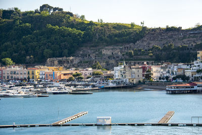 Boats moored at harbor