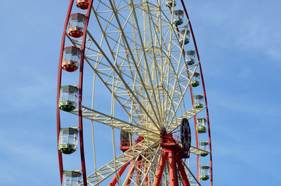 Low angle view of ferris wheel against sky