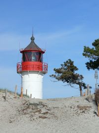 Low angle view of lighthouse against clear blue sky