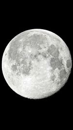 Low angle view of half moon against sky at night