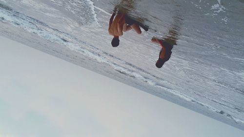 Woman jumping in water