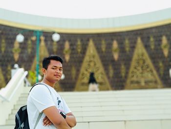 Portrait of smiling man standing outdoors