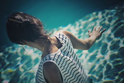 Side view of woman in swimming pool