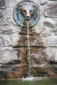 Low angle view of statue on water