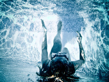 Woman swimming in sea