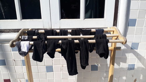 Clothes drying on clothesline against building