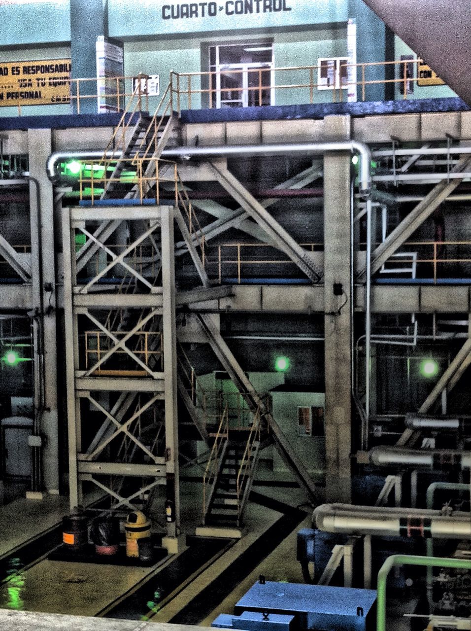 built structure, architecture, building exterior, metal, low angle view, building, railing, connection, construction site, city, metallic, day, outdoors, bridge - man made structure, no people, industry, factory, staircase, railroad track, railroad station