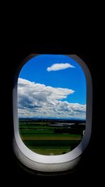 Scenic view of landscape against cloudy sky