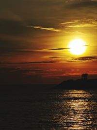 Scenic view of sea against romantic sky at sunset