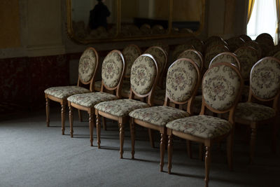 Empty old chairs on floor