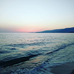 Scenic view of sea against clear sky during sunset