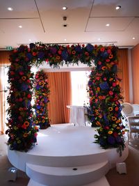 Flower vase on table in illuminated room