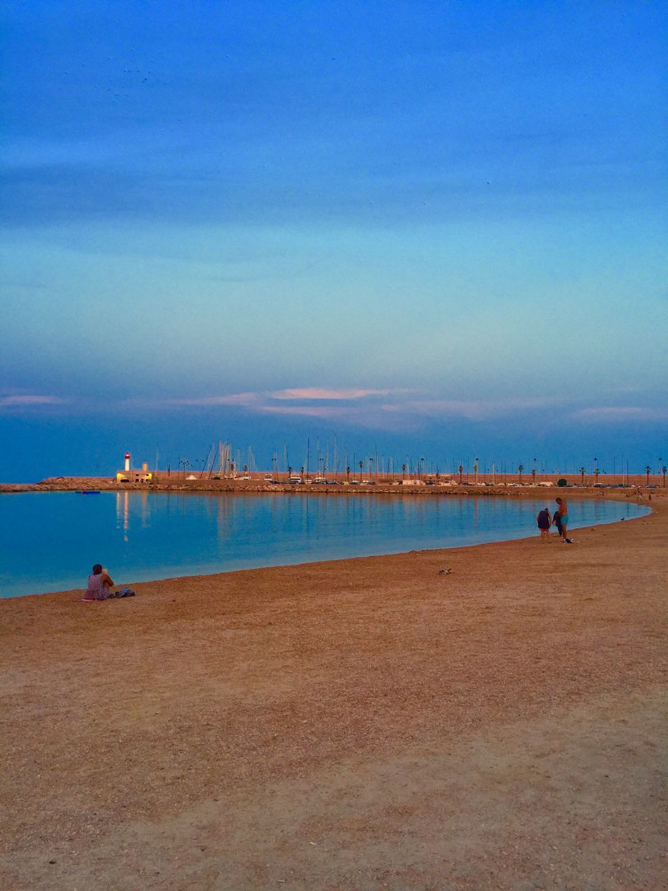 sea, water, sky, blue, nature, tranquility, cloud - sky, tranquil scene, scenics, nautical vessel, day, outdoors, beauty in nature, incidental people, cloud, built structure, horizon over water, bird, pier