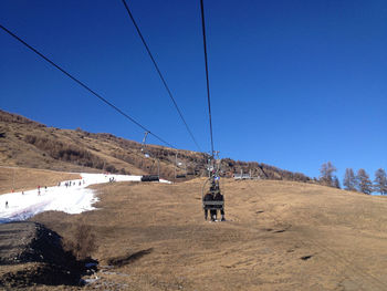 Scenic view of mountains against blue sky