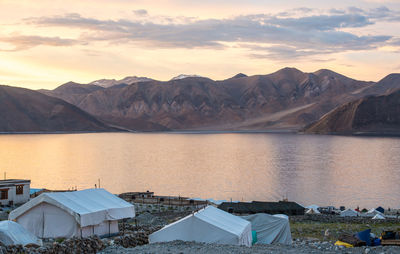 Scenic view of lake and mountains against sky