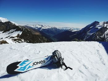 View of snowcapped mountain range against blue sky