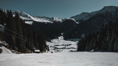 Scenic view of snow covered mountains against sky