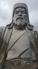 Low angle view of statue against sky