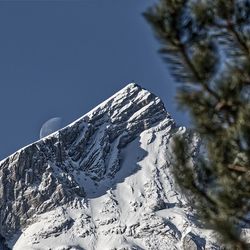 Scenic view of snowcapped mountains against clear sky