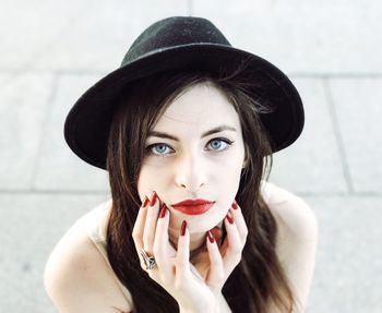 High angle portrait of beautiful woman standing on field