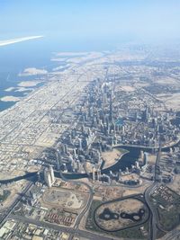 High angle view of city buildings against sky
